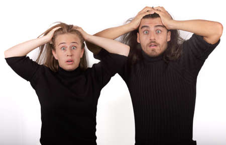 Young and beautiful blonde woman in black sweater and a handsome man in black sweater both making...
