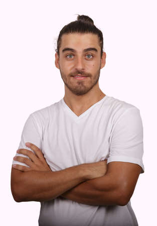 young man in white T-shirt with white background making funny gesturesの写真素材