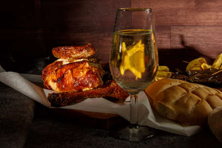 glass of wine with chicken and potatoes, healthy food, homemade food, family food, take away food