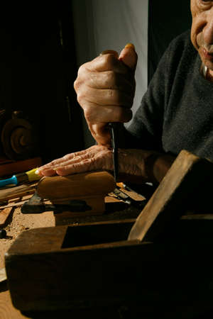 Craftsmans hands working on wood carving, with gouge and chisel Cabinetmaker, carpentryの写真素材