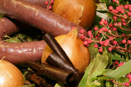 food ingredients with homemade chorizo, black pudding, onions and meat on the tableの写真素材
