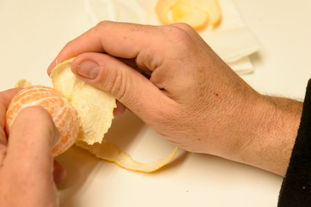 Peeling a Citrus Fruit A CloseUp Focus That Captures the Beauty of the Process