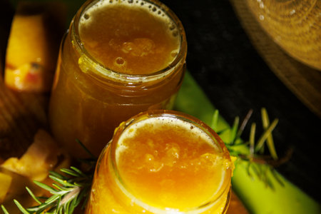 Creating aromatic homemade herbal infusions using colorful fresh ingredients in jarsの写真素材