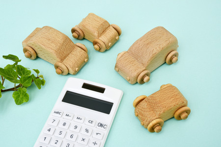 Wooden cars and calculator-Image of car purchaseの写真素材