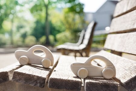 Wooden Toy Cars on Wooden Bench.の写真素材