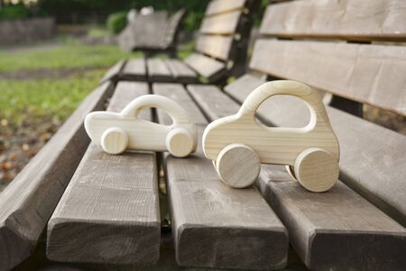 Wooden Toy Cars on Wooden Bench.の写真素材