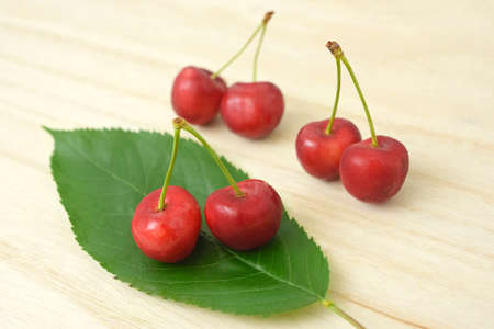 Cherry fruits and leaves.