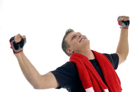happy man showing winning gesture on an isolated backgroundの写真素材