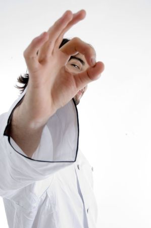 chef looking through finger hole with white background
