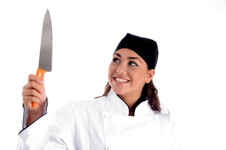 smiling chef with knife on an isolated backgroundの写真素材