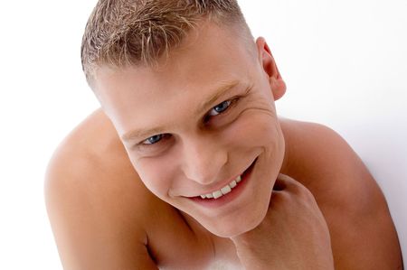 close up of smiling muscular man with white backgroundの写真素材