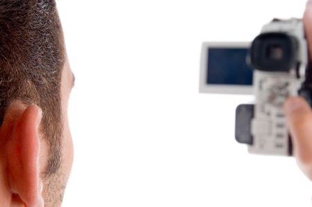 professional man recording with handy cam against white backgroundの写真素材