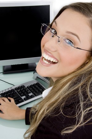 pleased woman looking at camera with white backgroundの写真素材
