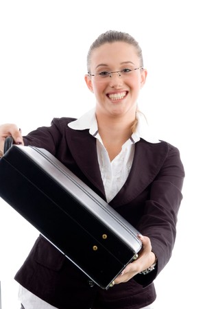 smiling woman showing briefcase against white backgroundの写真素材