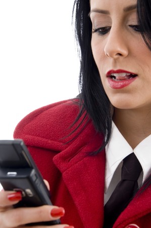 young woman reading a text message on an isolated white backgroundの写真素材