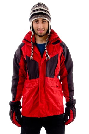 young man in woolen cap and winter jacket on an isolated white background
