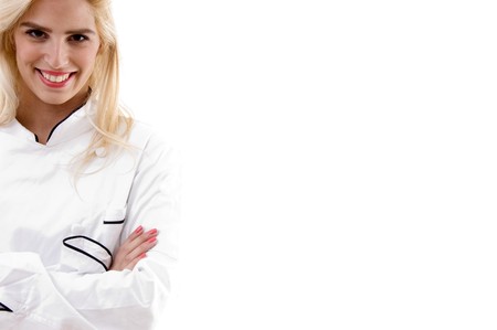front view of smiling young doctor on an isolated white backgroundの写真素材