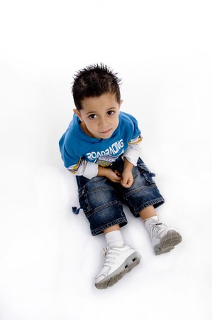 smart boy sitting with white backgroundの写真素材