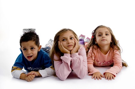 posing cute little siblings with white backgroundの写真素材