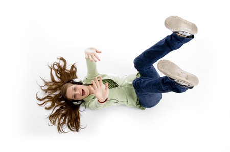 female lying showing shoe soles against white backgroundの写真素材