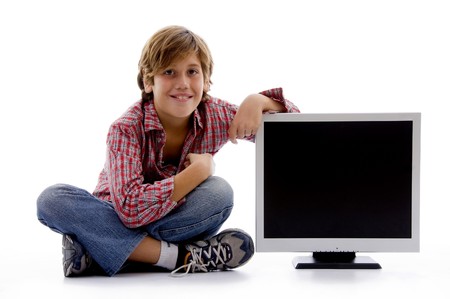 front view of sitting boy with lcd screen on an isolated white backgroundの写真素材
