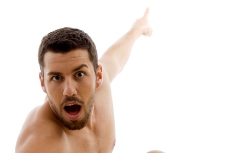 front view of surprised man pointing with white backgroundの写真素材