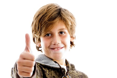 front view of pleased kid with thumbs up with white background