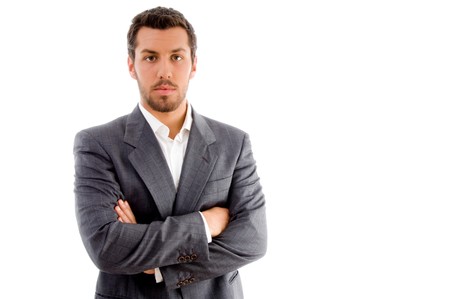 portrait of businessman with folded hands on an isolated white backgroundの写真素材