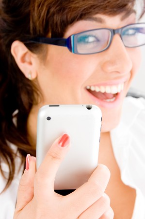 side pose of smiling young female holding ipodの写真素材