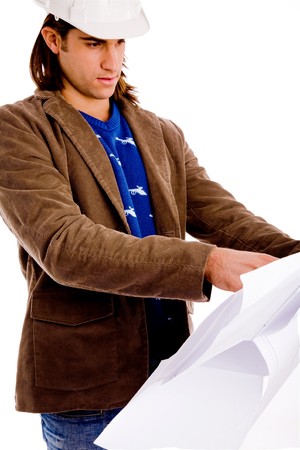 side view of architect looking blueprint with white backgroundの写真素材