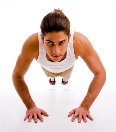 front view of man doing pushups on an isolated background