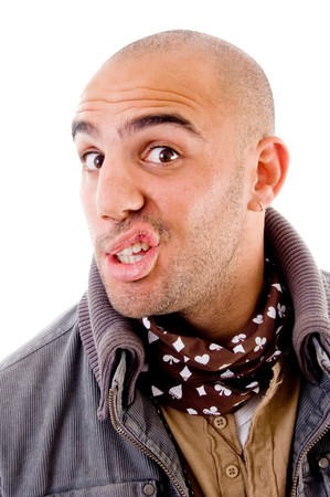 young man with facial expression on an isolated backgroungの写真素材