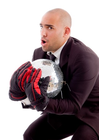 bald male holding disco mirror ball with white backgroundの写真素材