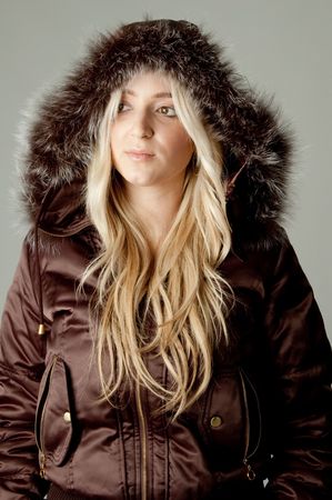 portrait of model wearing hood jacket on an isolated backgroundの写真素材