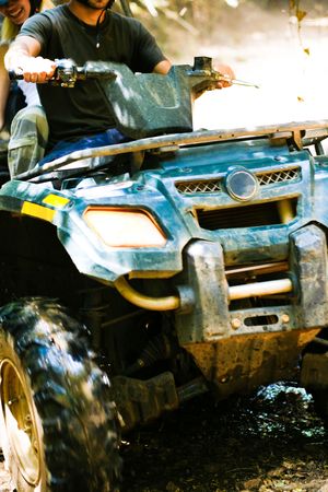 Close-up of couple riding fun machine