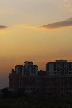 Buildings in a city at duskの写真素材