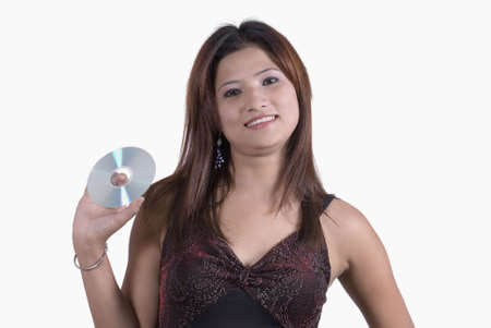 Portrait of a young woman holding a CD and smiling