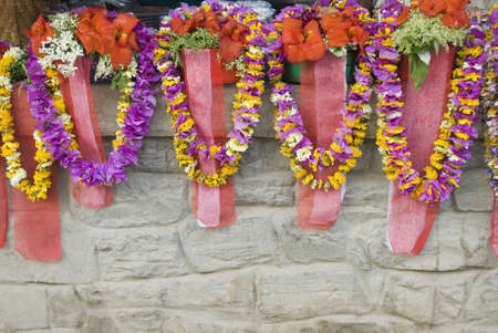 Religious offerings and garlands on a temple wall, Katmandu, Nepalの写真素材