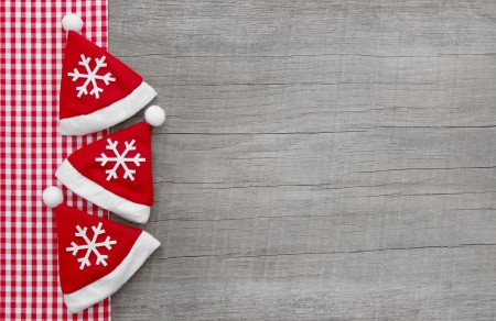 Top view of three Santa hat on wooden backgroundの写真素材