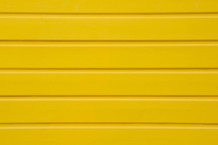 Texture of a wooden yellow background for summer or holiday conceptsの写真素材