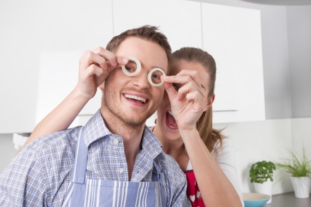 Loving couple cooking together in the kitchenの写真素材