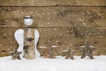 Christmas  Angel and wooden stars with snowflake design on wooden - handmade idea の写真素材