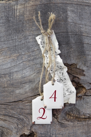 Top view of  music sheet and 24 for christmas on wooden background - country styleの写真素材