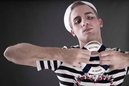 Welcome on Board - a sailor with little lifebuoyの写真素材