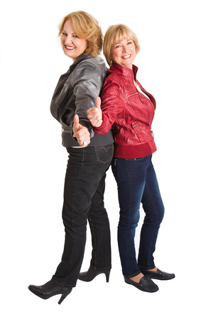 Gratulation  two older woman - girlfrieds - with thumbs upの写真素材