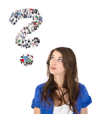 Pensive isolated female teenager searching in a flirting line.の写真素材