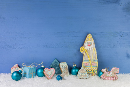 Blue wooden christmas background with Santa Claus of gingerbread.の写真素材