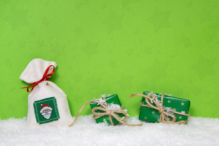 Christmas presents on snowy background. Idea for a xmas voucher.の写真素材