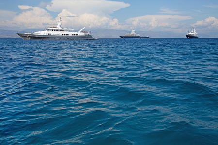 Luxury large super or mega motor yacht in the blue ocean.