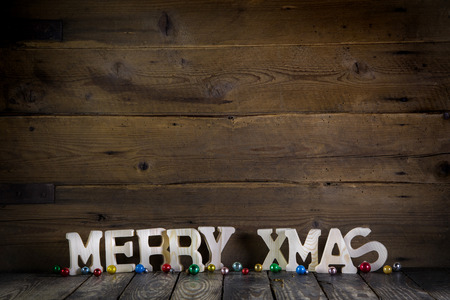 Merry christmas text on wooden old rustic background.の写真素材